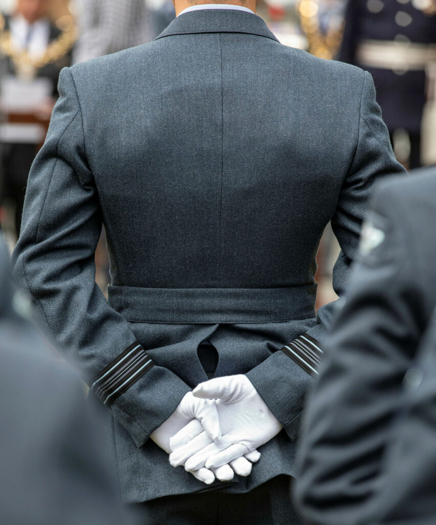 Back shot of a soldier holding hands behind back