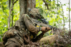 Side profile of veteran with a gun