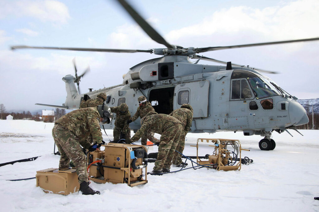 A group of veterans handling machinery in freezing conditions