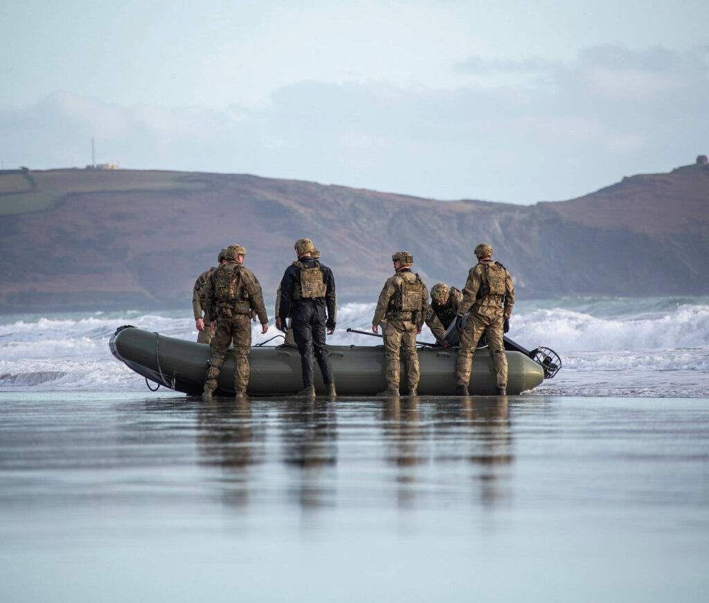 A group of soldiers getting a boat ready